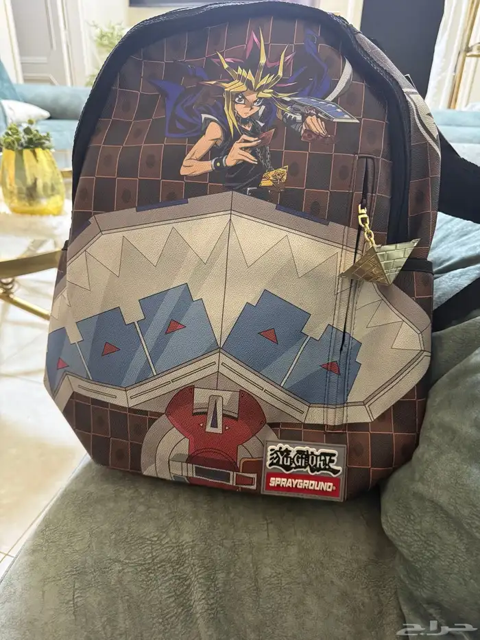 شنطة ماركة سبراي جراوند من انمي يوجي اوه 7