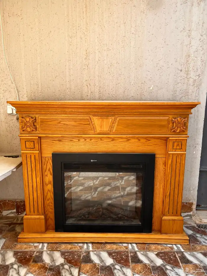 للبيع دفاية كهربائية مع ديكور خشبي فاخر 0