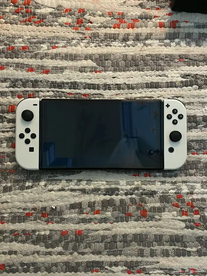 نينتندو سويتش اوليد مع كامل ملحقاته واشرطه 0