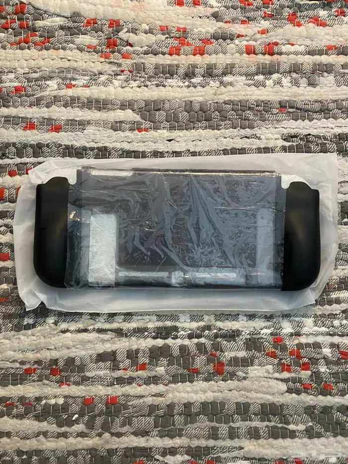 نينتندو سويتش اوليد مع كامل ملحقاته واشرطه 13