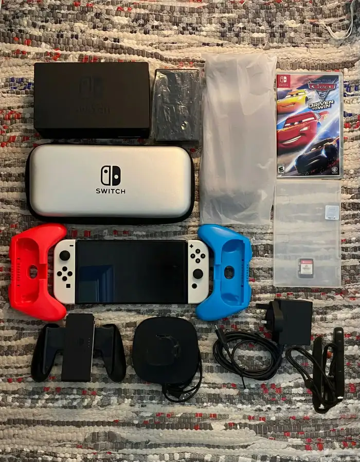 نينتندو سويتش اوليد مع كامل ملحقاته واشرطه 19