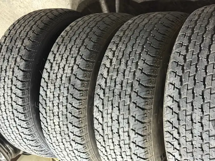 أربع كفرات دعسة برجستون شبه الجديد مقاس 16-70-275 3