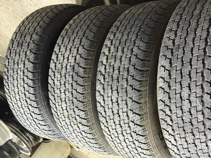 أربع كفرات دعسة برجستون شبه الجديد مقاس 16-70-275 1