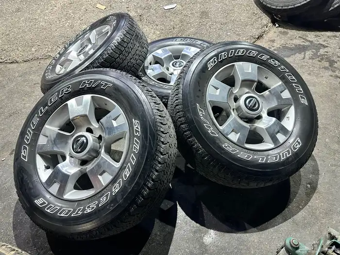 جنوط نيسان فتك اصلي وكاله  مع كفرات بريجستون 275.65.17 ت22 29