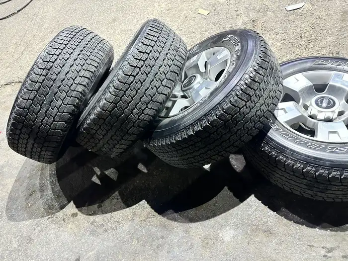 جنوط نيسان فتك اصلي وكاله  مع كفرات بريجستون 275.65.17 ت22 21
