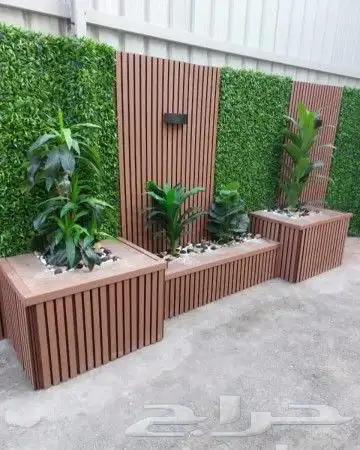 تنسيق حدائق عشب صناعي وبديل الخشب والإضاءة وعشب طبيعي واشجار 9