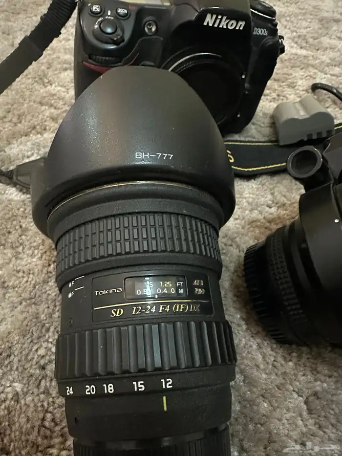 كاميرا Nikon D300s وعدسات تصوير وفلاتر وفلاش وبطاريات 12