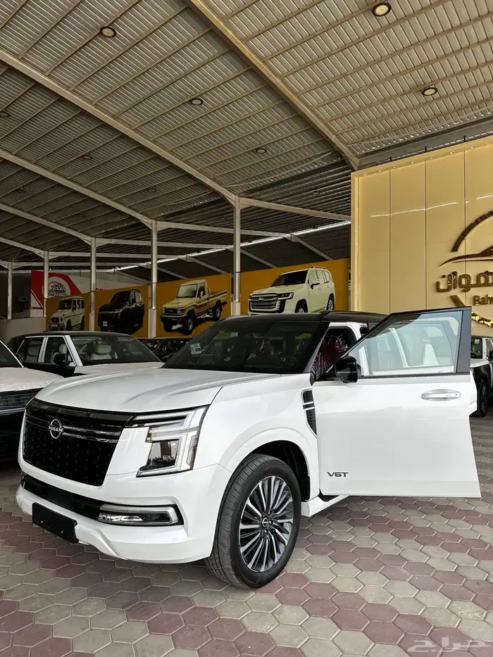 نيسان بلاتينوم فل كامل 2026 توين تربو ابيض سقف اسود 1