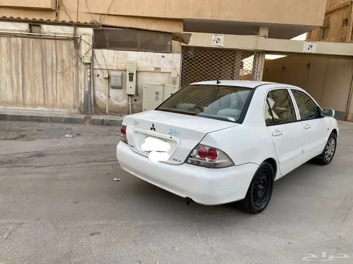 سيارة متسوبيشي لانسر موديل 2009 4