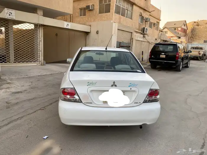 سيارة متسوبيشي لانسر موديل 2009 7