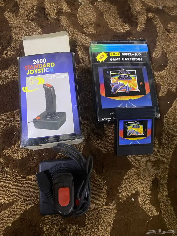 يد أتاري كمبيوتر وشريط 0