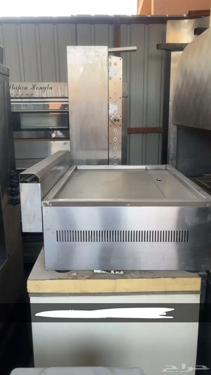 اله شاورما مع اصياخها و اله تسخين او هيتر 1