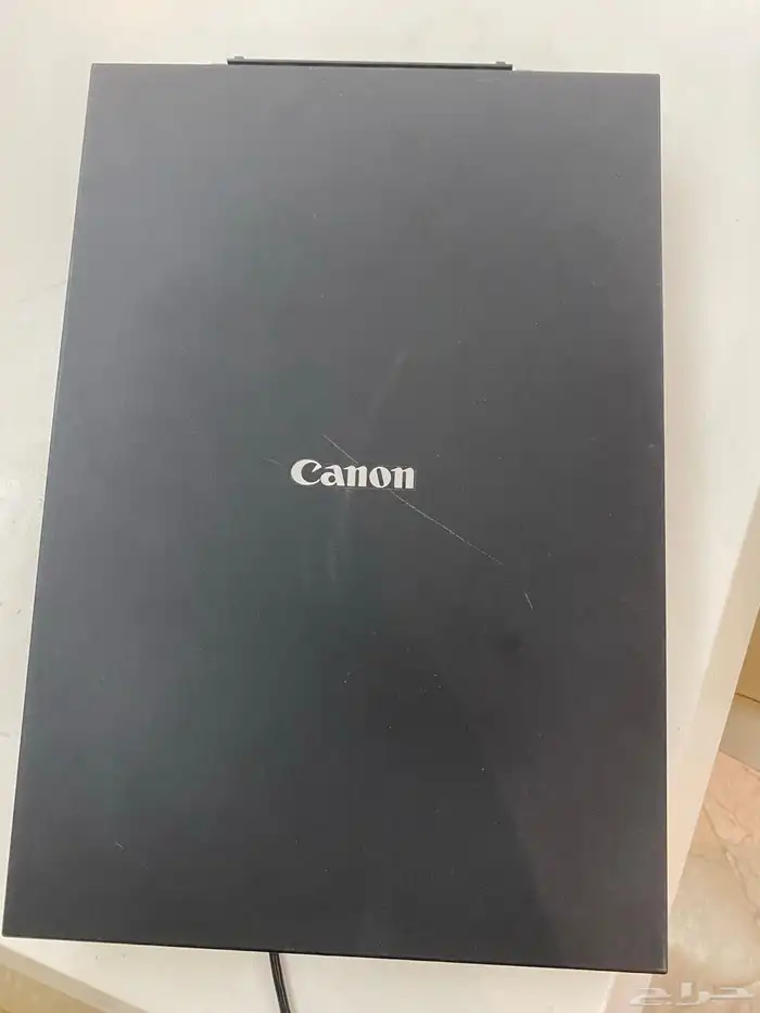 طاوله سته كراسي من هوم سنتر و اسكنر Canon 5
