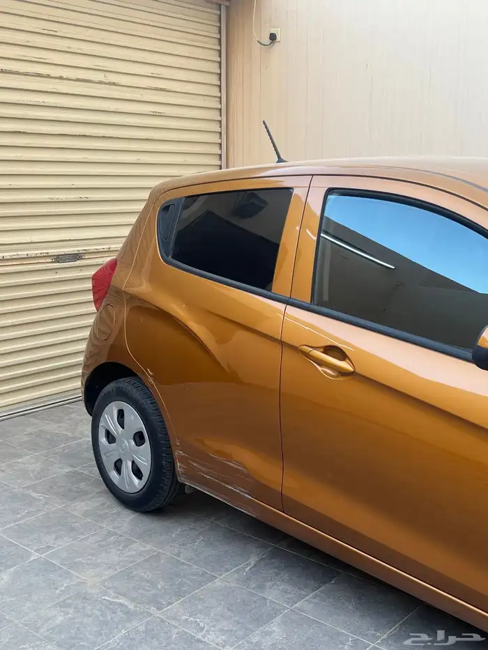 سيارة سبارك برتقالية استعمال نظيف 1