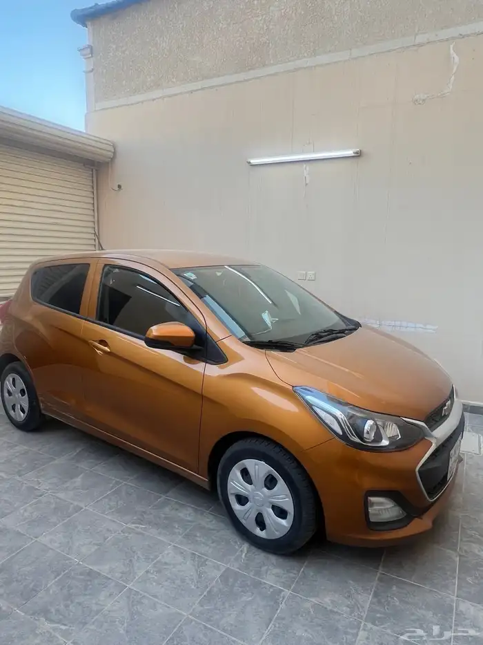 سيارة سبارك برتقالية استعمال نظيف 2