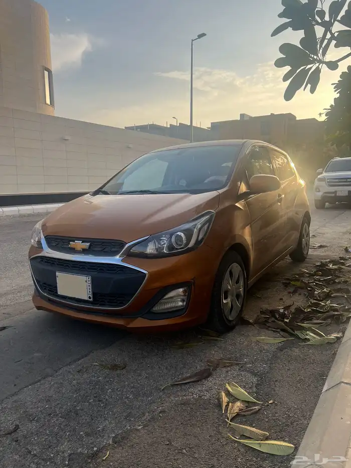 سيارة سبارك برتقالية استعمال نظيف 0