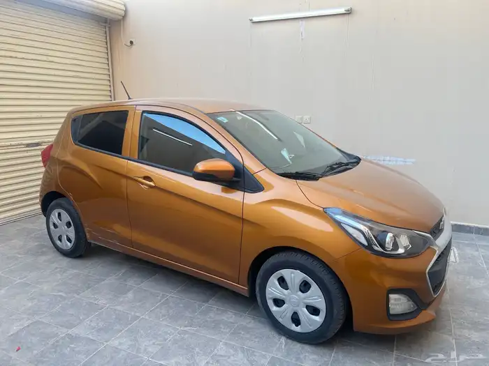 سيارة سبارك برتقالية استعمال نظيف 3