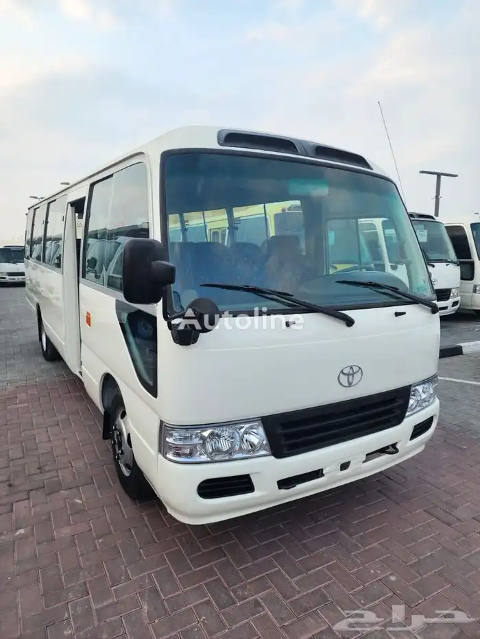 Toyota Coaster available for rent with driver Pick and drop 1