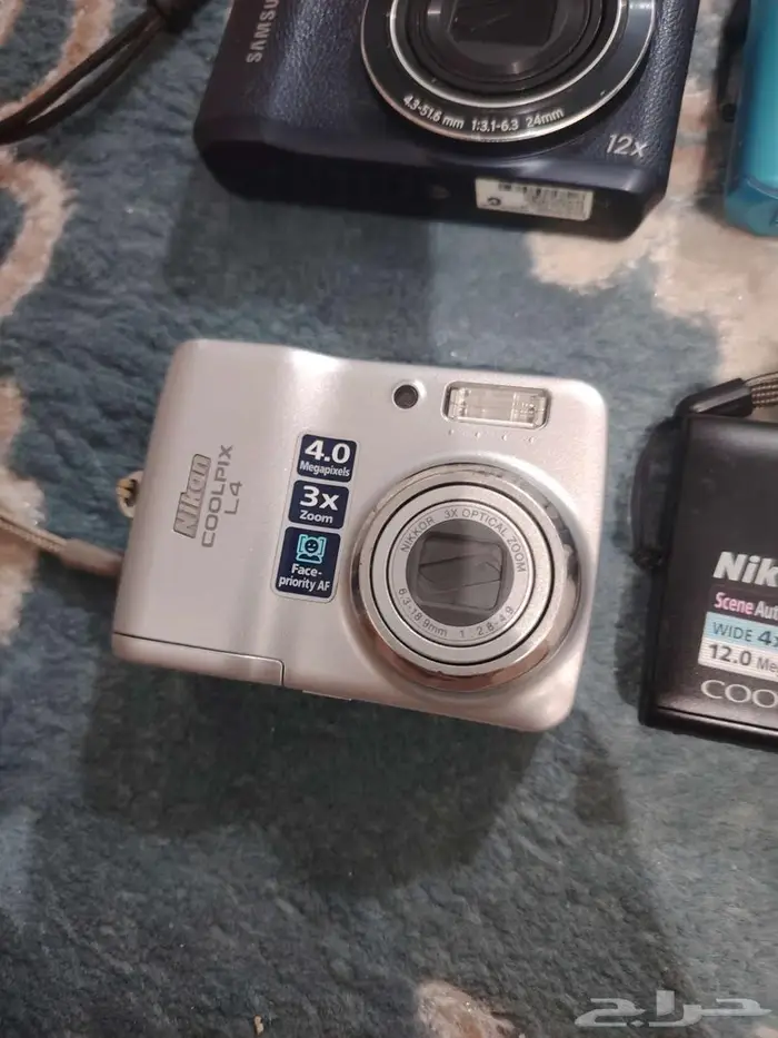 كاميرا ديجيتال نيكون و سامسونج زي الجديد 1
