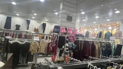 محل ملابس جاهزه نسائية وأطفال لتقبيل بكامل محتوياته index