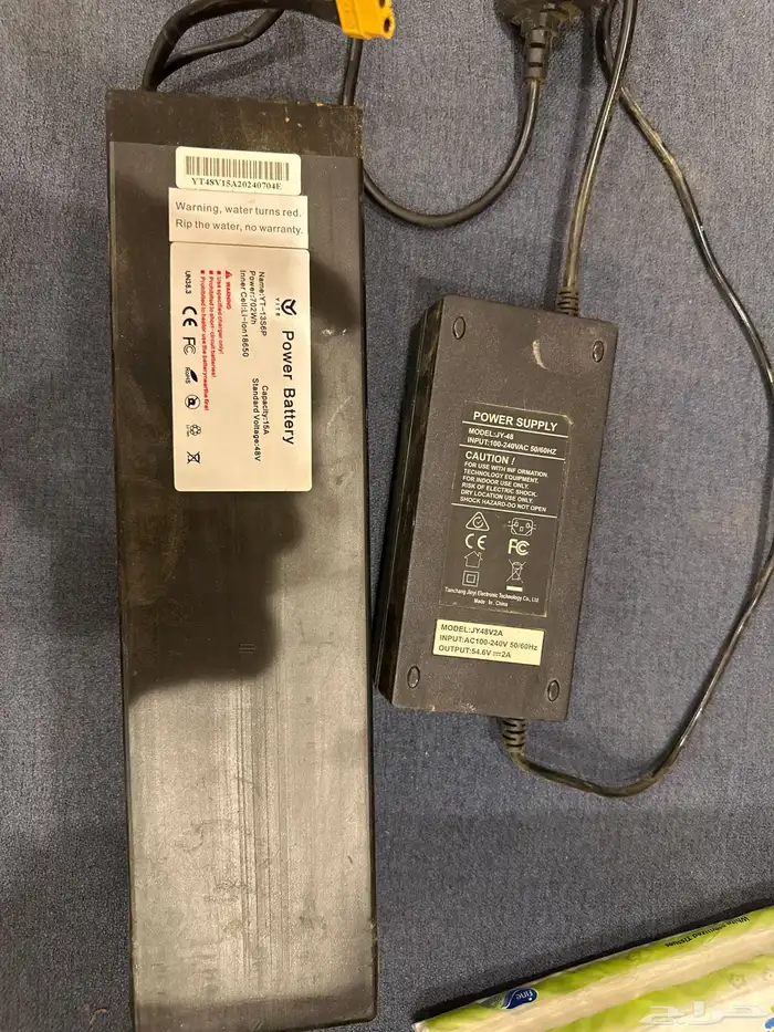 بطارية سكوتر الوحش بشاحناه بحاله جديده 0