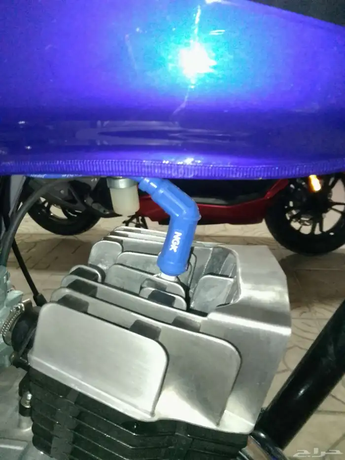 أكس 100 وسام ناري أزرق 2026 محول سوزوكي 9