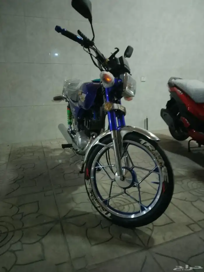 أكس 100 وسام ناري أزرق 2026 محول سوزوكي 8