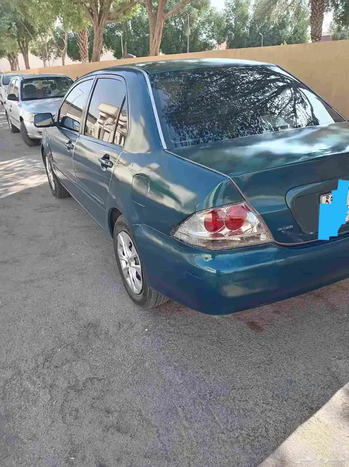 لانسر بومه موديل 2006 استمارة 3 سنوات فحص جديد سنه مكينه جير 1