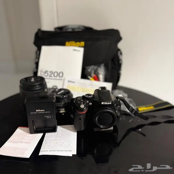 كاميرا نيكون D5200 مع استاند بحالة ممتازه 0