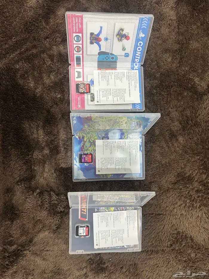 للبيع  جهاز Nintendo Switch OLED مع ثلاث ألعاب أصلية 3