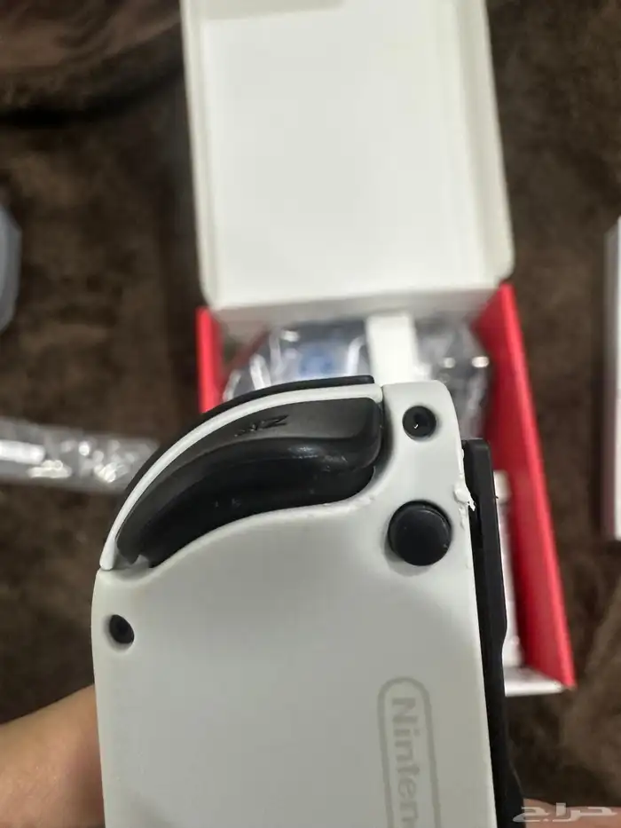 للبيع  جهاز Nintendo Switch OLED مع ثلاث ألعاب أصلية 9