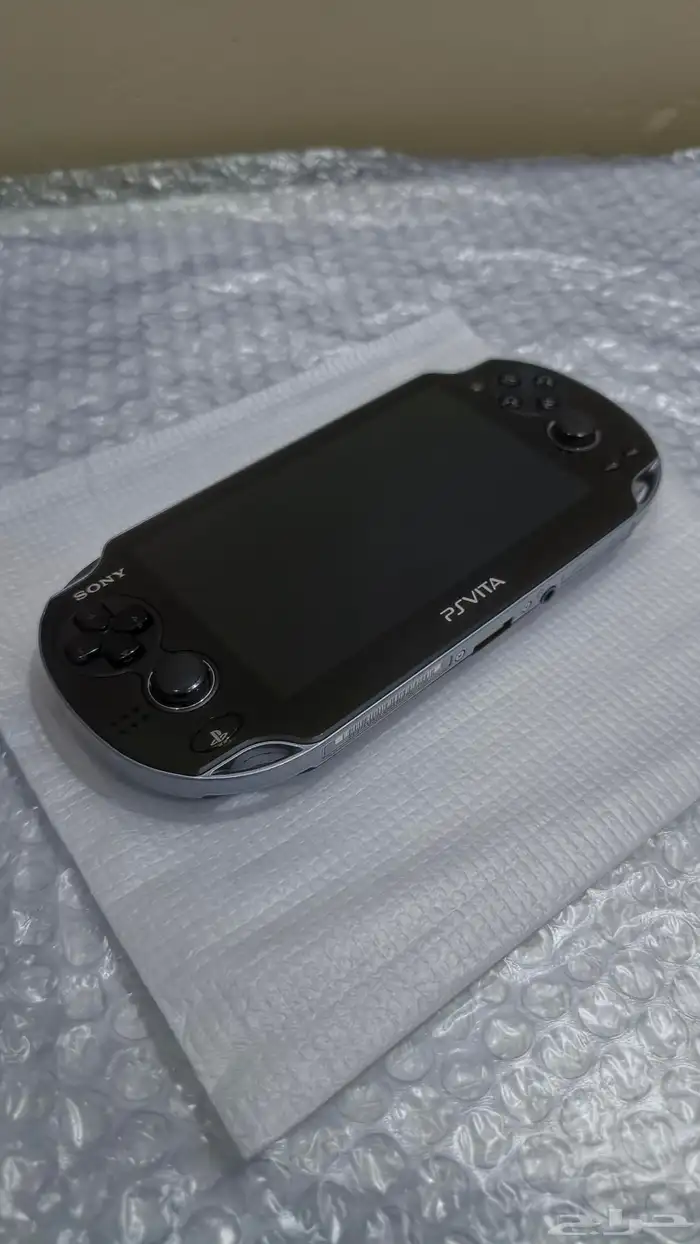 سوني PS Vita مع اغراضه والاشرطه 5