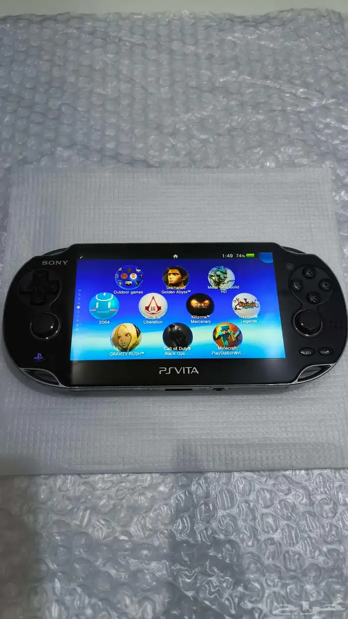 سوني PS Vita مع اغراضه والاشرطه 8