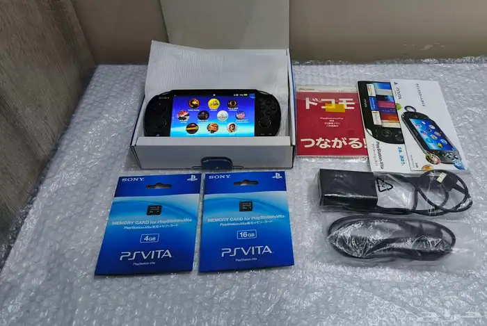 سوني PS Vita مع اغراضه والاشرطه 0