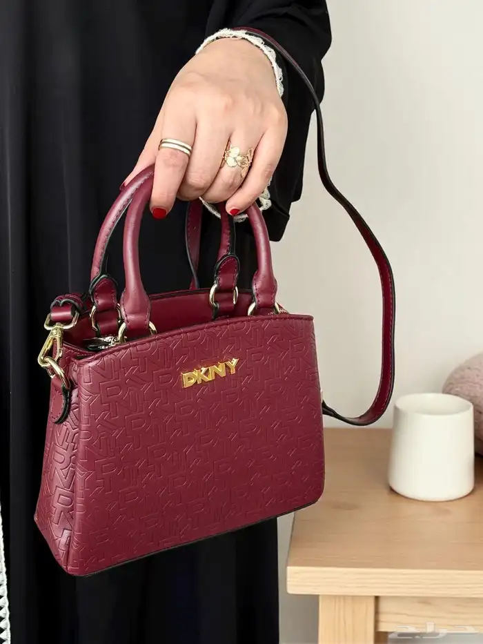 متجر_كاتشي شنطة كتف من دكني بلون المشمش وتصميم عصري. 1