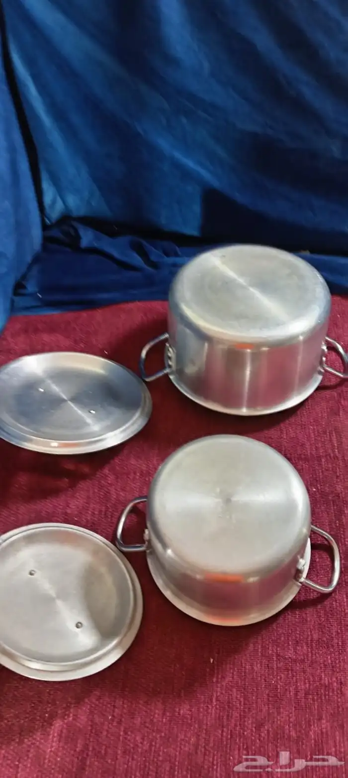 قدور معدن مع مغارف 11