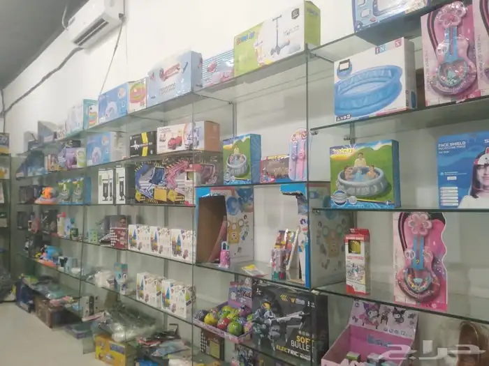 رفوف محل بالنرجس مع جهاز كاشير 4