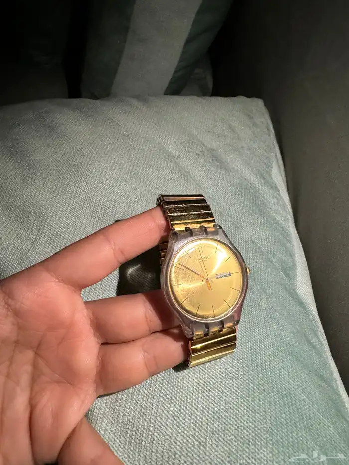 ساعة سواتش ذهبي مطاط 0