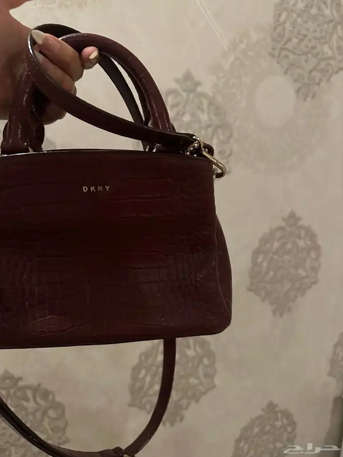 شنطة دكني لون برغندي 0