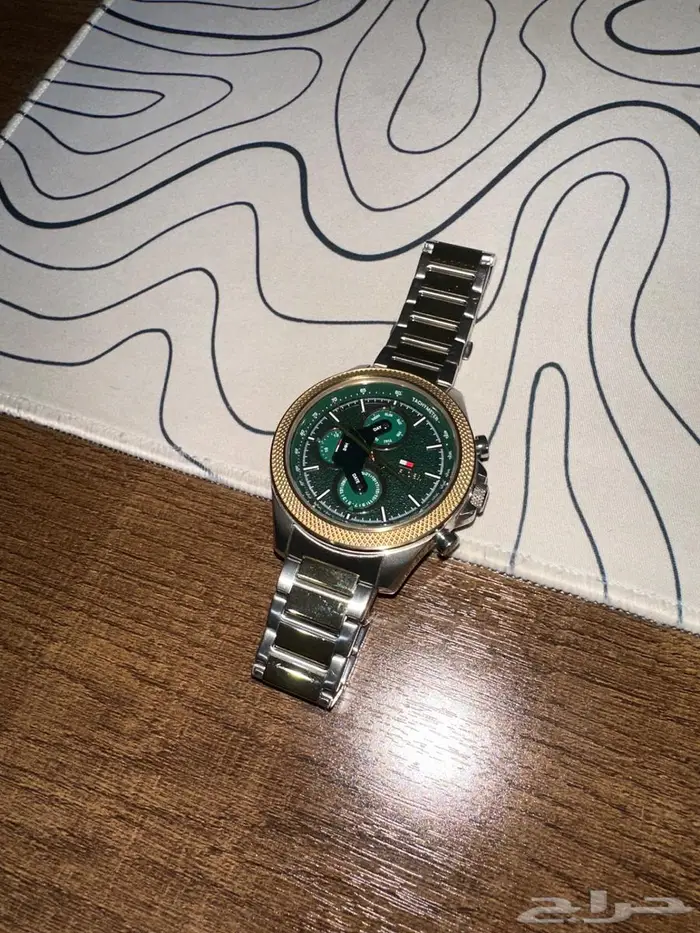 green dial gold bezel watch تومي 1