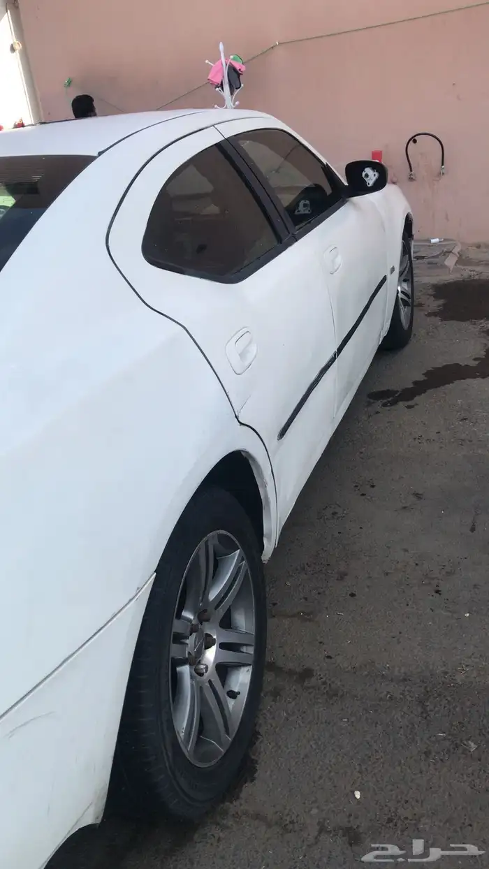 دوج موديل 2006 ابيض ست سلندر 2