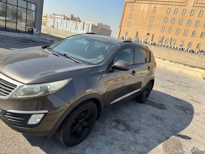 للبيع كيا سبورتاج 2013 نظيفة جدا 2000 سي سي   لون بني 1