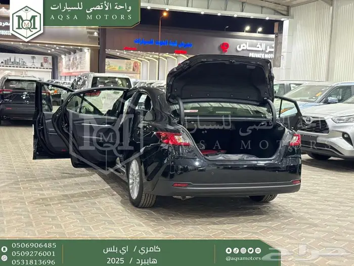كامري E بلس أسود هايبرد 2025 عليها عرض 23