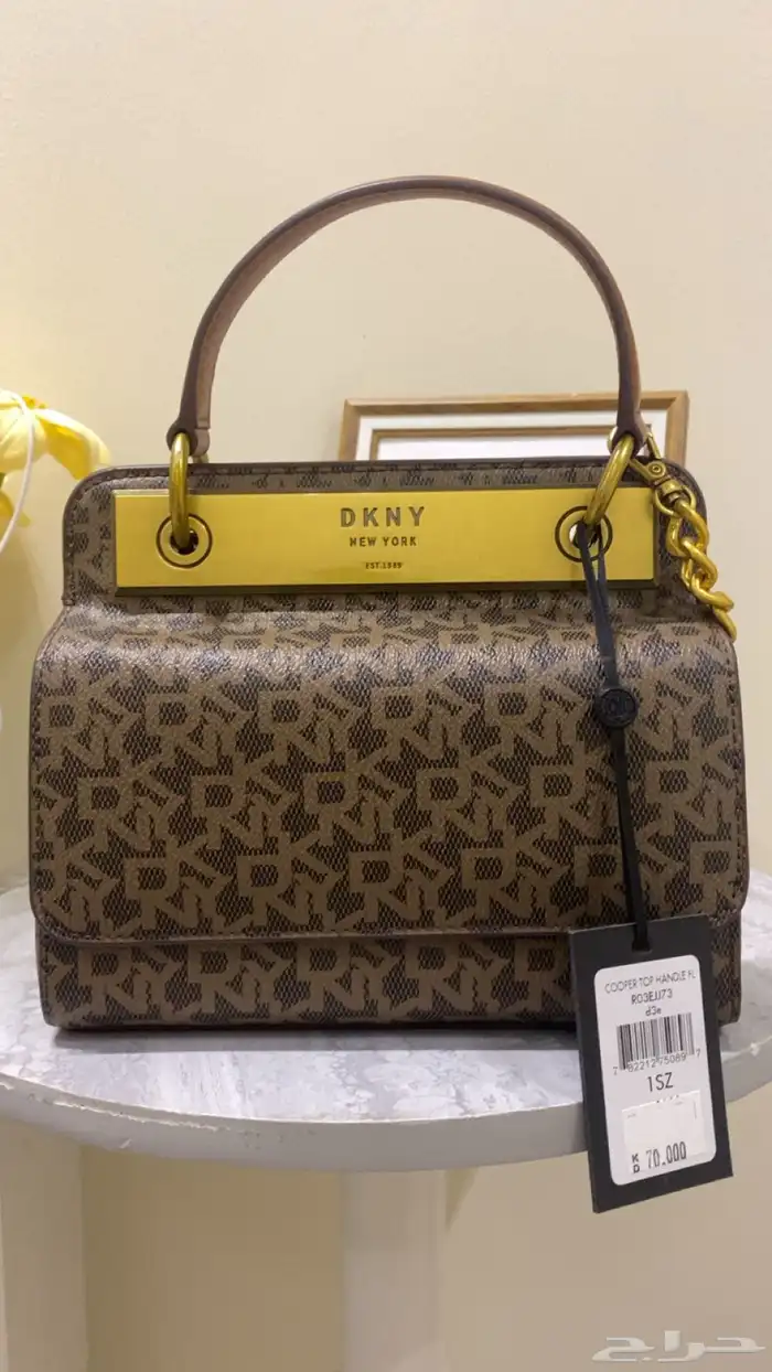 فايندرا حلق فضه ساعه ديور درجه اولى وشنطه كروسبوديDKNY 10