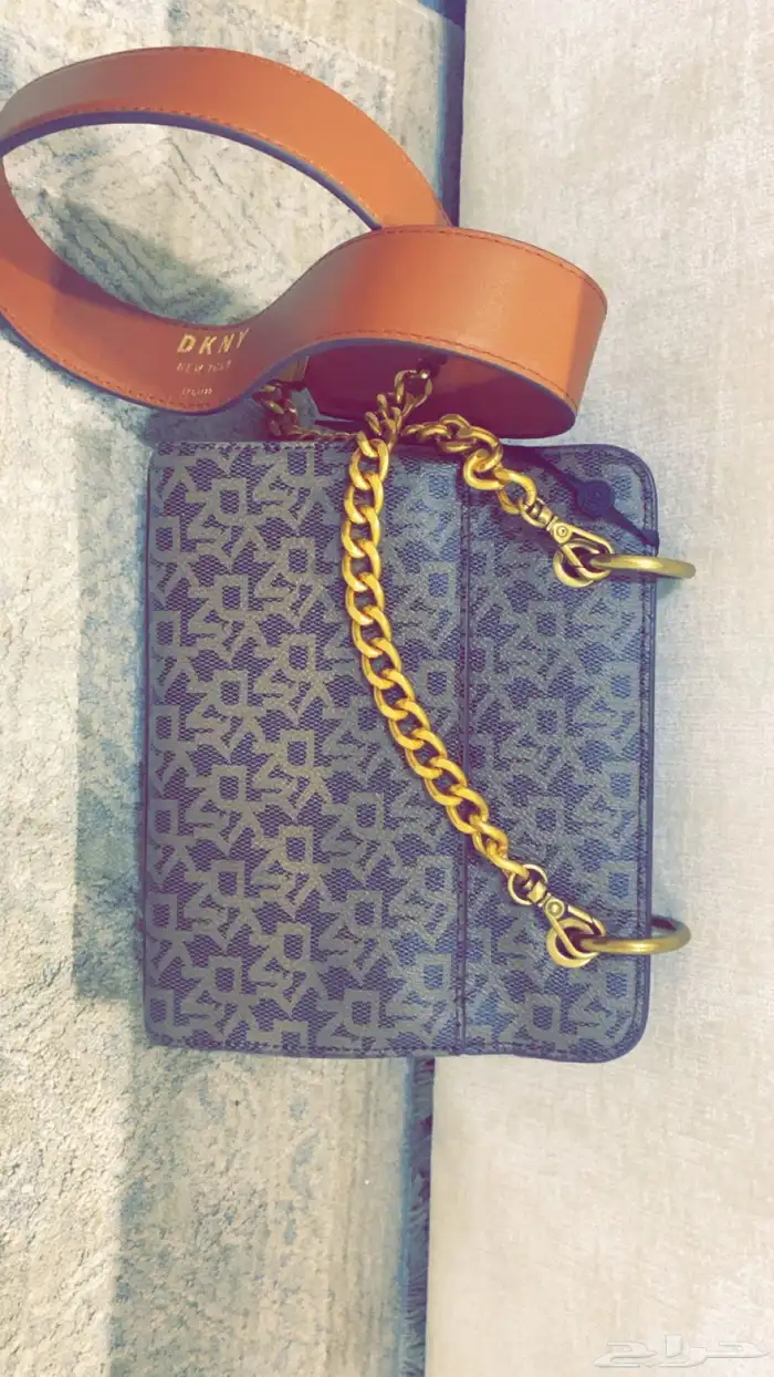 فايندرا حلق فضه ساعه ديور درجه اولى وشنطه كروسبوديDKNY 17