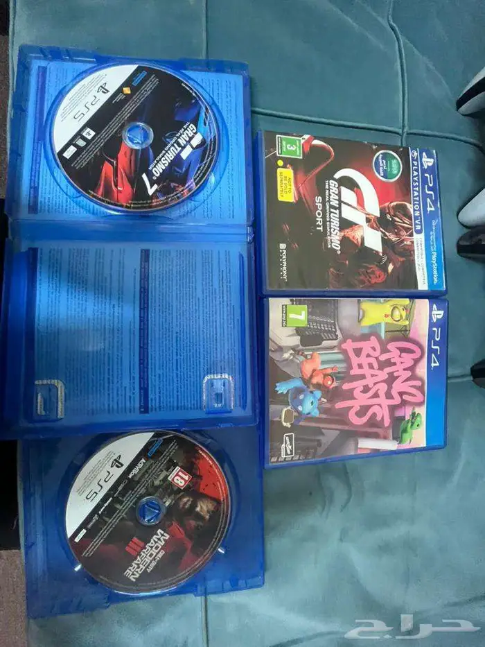 Playstation 5 with 2 controllers and 4 CDs 2