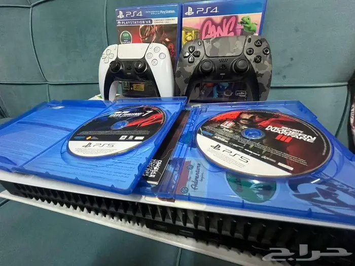 Playstation 5 with 2 controllers and 4 CDs 1