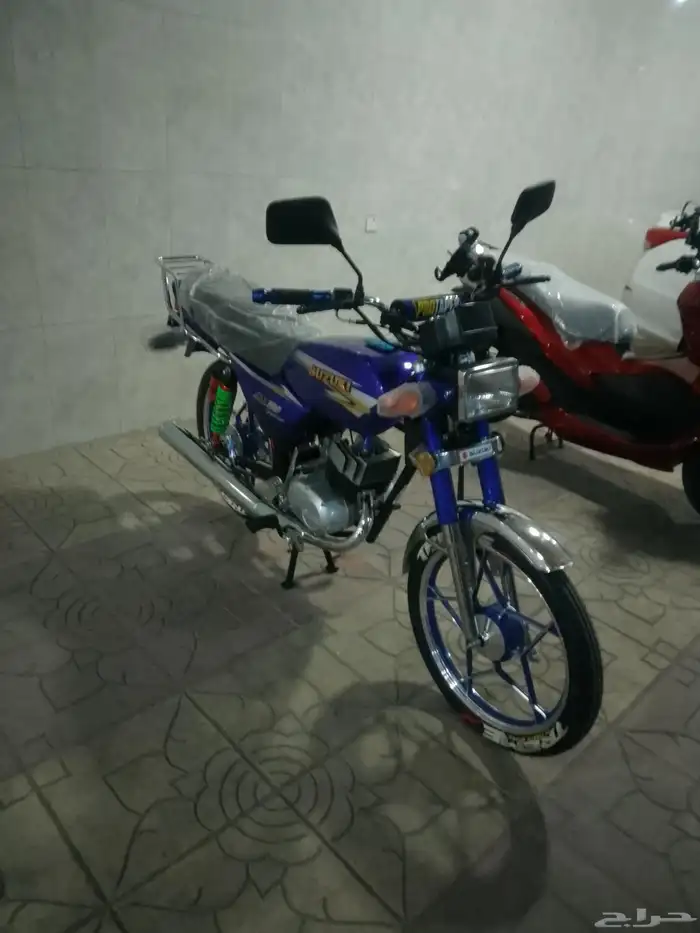 أكس 100 وسام ناري أزرق 2026 محول سوزوكي 18
