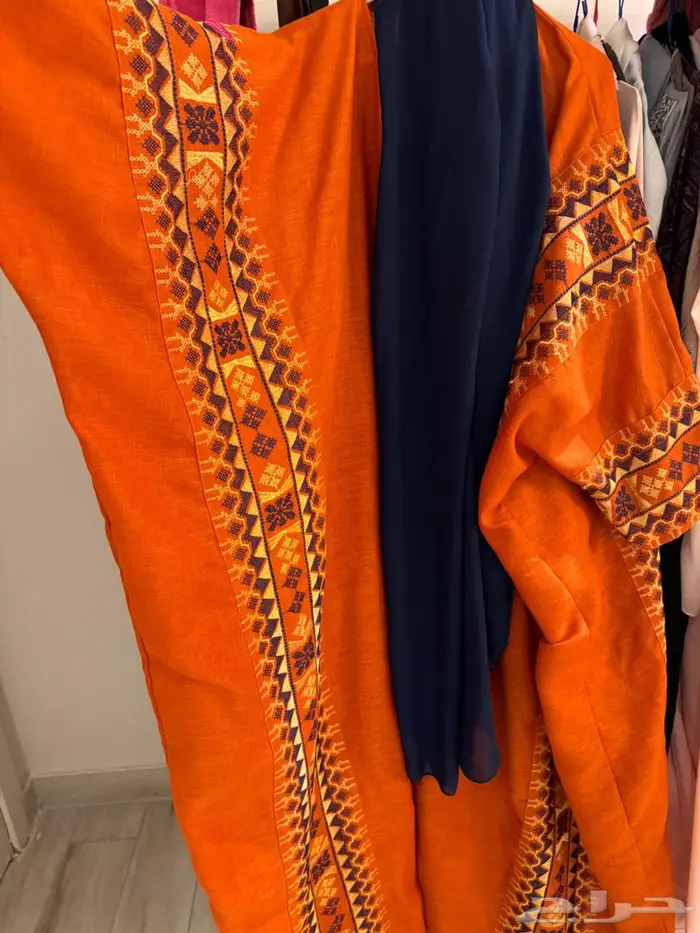 عبايه برتقاليه من ثري لاينز 1