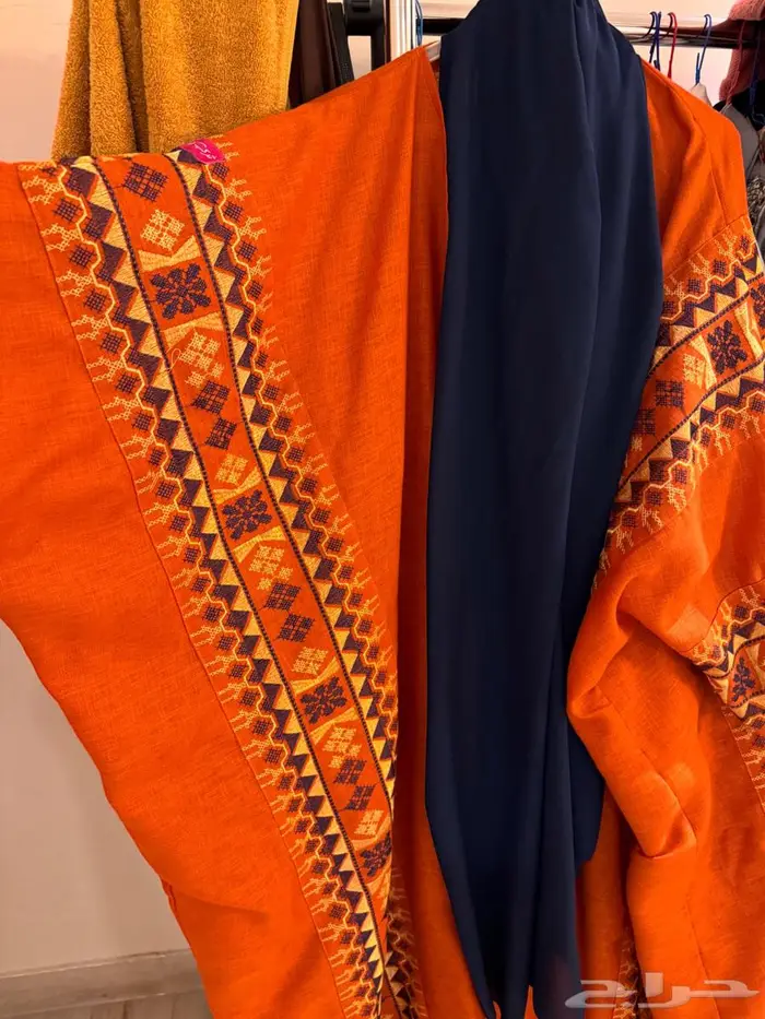 عبايه برتقاليه من ثري لاينز 4